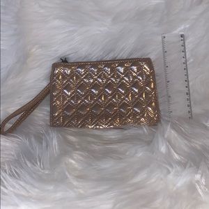 Rose gold metallic wristlet clutch